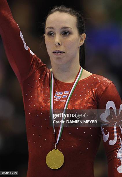 Britain's Elizabeth Tweddle celebrates with her gold medal on the podium of the floor exercise at the Third European Women's Artistic Championships...