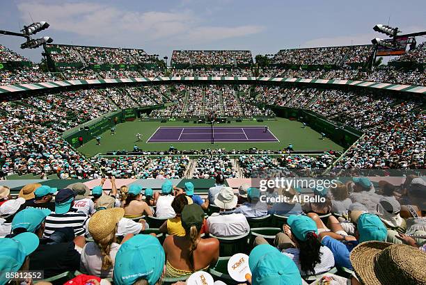 Fans watch as Novak Djokovic of Serbia plays against Andy Murray of Great Britain during the men's final of the Sony Ericsson Open at the Crandon...