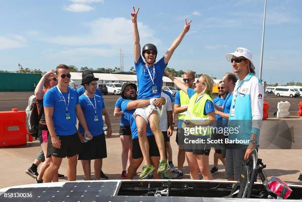 Team members congratulate the driver after Solveig, the car from Sweden's JUsolarteam and Jnkping University passes the figure 8 testing at the...