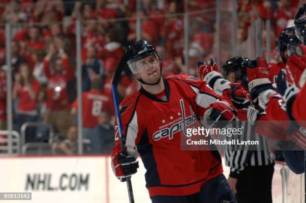Mike Green of the Washington Capitals celebrates a third period goal with the bench during a NHL hockey game against the Atlanta Thrashers on April...
