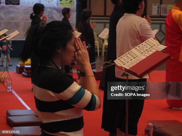 One of the Buddhist devotees is seen praying with other devotees while the monk lead them. Wesak is the most important day for Buddhist devotees as...