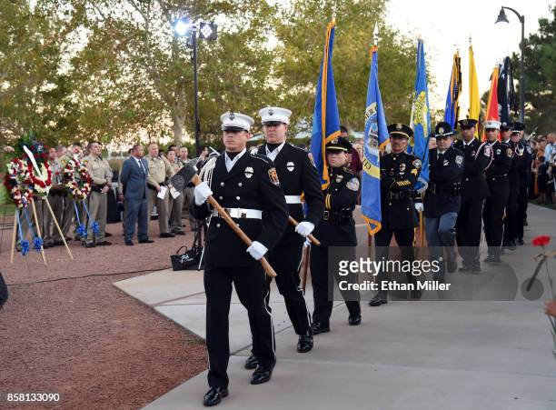 An honor guard arrives at the start of a vigil for Las Vegas Metropolitan Police Department Officer Charleston Hartfield at Police Memorial Park on...