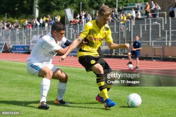 Gorka Zabarte Moreno of Real Madrid and Florian Rausch of Dortmund battle for the ball during the EMKA RUHR-Cup International Final match between...