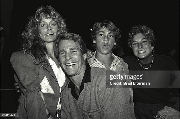 Farrah Fawcett, Ryan O'Neil, Griffin O"Neal and Tatum O'Neal backstage at a Rolling Stones concert circa 1980 in Los Angeles, California.**EXCLUSIVE**