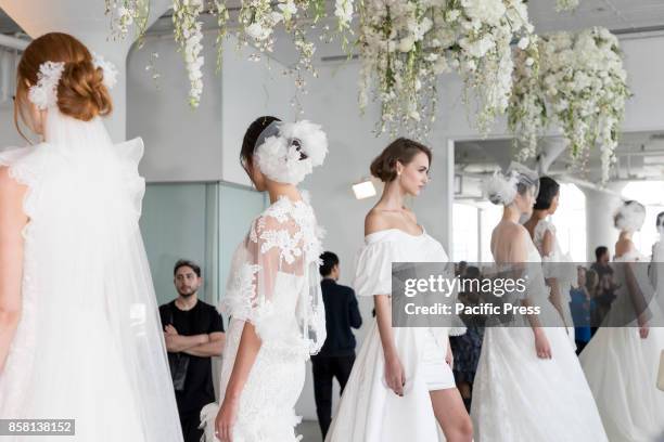 Models show out a dress by Georgina Chapman and Keren Craig for Marchesa and Notte Fall/Winter 2018 Bridal Presentation during New York Bridal Week...