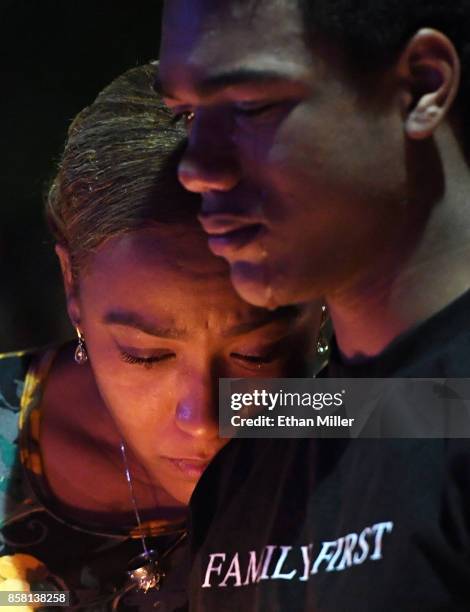 Veronica Hartfield , widow of slain Las Vegas Metropolitan Police Department Officer Charleston Hartfield, and their son Ayzayah Hartfield attend a...