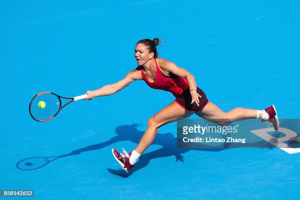 Simona Halep of Romania returns a shot during the Women's singles Quarterfinals match against Daria Kasatkina of Russia on day seven of 2017 China...