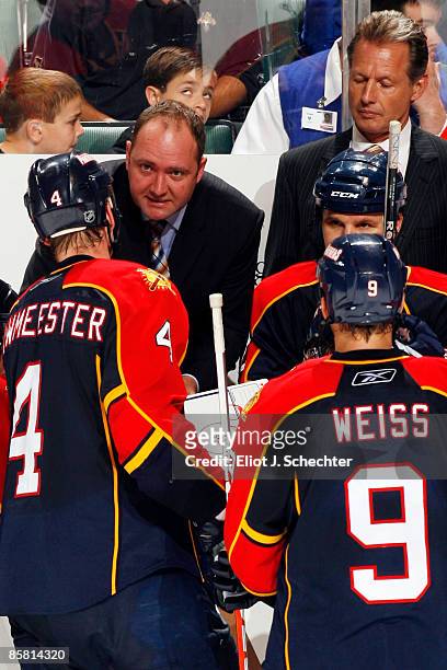 Head Coach Peter DeBoer along with assistant Mike Kitchen of the Florida Panthers direct the team from the bench against the Pittsburgh Penguins at...