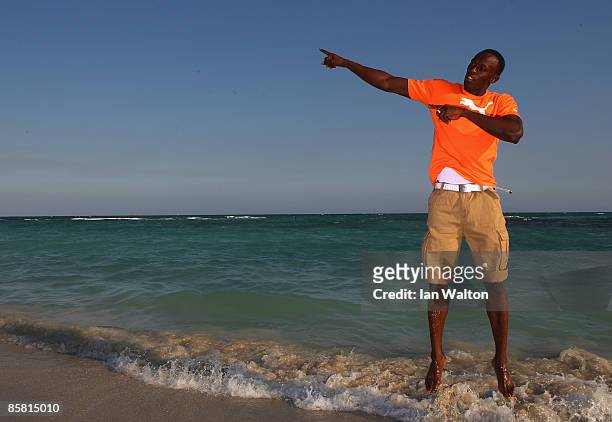 Usain Bolt of Jamaica poses during a photo shoot at the Hellshire beach on April 5, 2009 in Kingston, Jamaica.