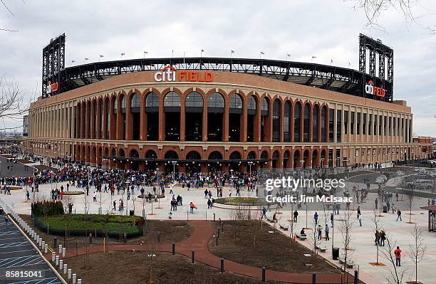 Fans arrive for the exhibition game between the New York Mets and the Boston Red Sox on April 4, 2009 at Citi Field in the Flushing neighborhood of...