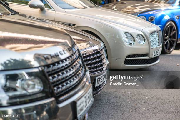 luxury sport cars on the streets of london - range rover stock pictures, royalty-free photos & images