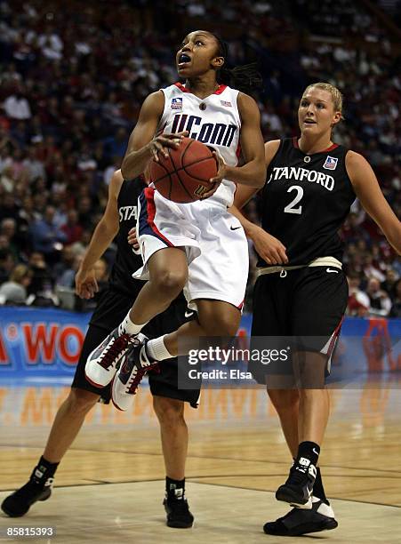 Renee Montgomery of the Connecticut Huskies goes up for two as Jayne Appel of the Stanford Cardinal defends during the Women's Final Four Semifinals...