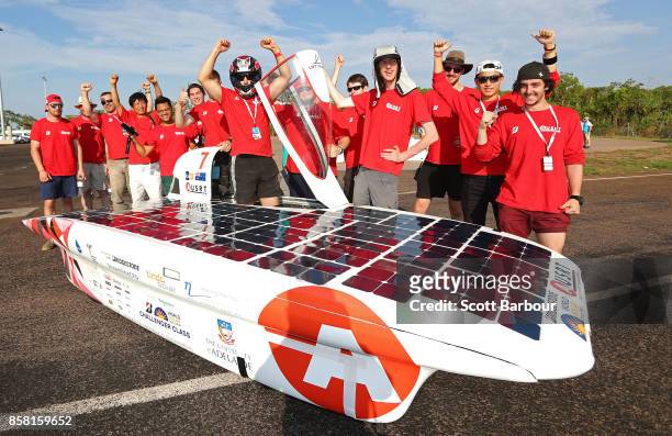 Team members celebrate after Lumen II, the car from Australia's Adelaide University Solar Racing Team passes the figure 8 testing at the Hidden...
