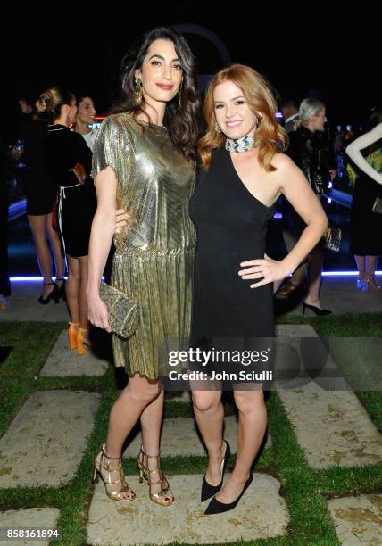 Amal Clooney and Isla Fisher at Farfetch and William Vintage Celebrate Gianni Versace Archive hosted by Elizabeth Stewart and William Banks-Blaney on...