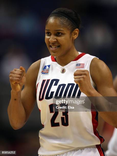 Maya Moore of the Connecticut Huskies celebrates a point on April 5, 2009 during the Womens Final Four Semifinals at the Scottrade Center on April 5,...