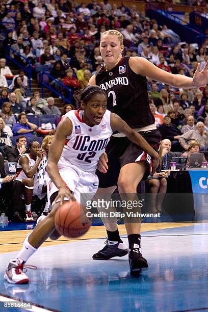 Kalana Greene of the Connecticut Huskies drives past Jayne Appel of the Stanford Cardinal on April 5, 2009 during the NCAA Women's Final Four...