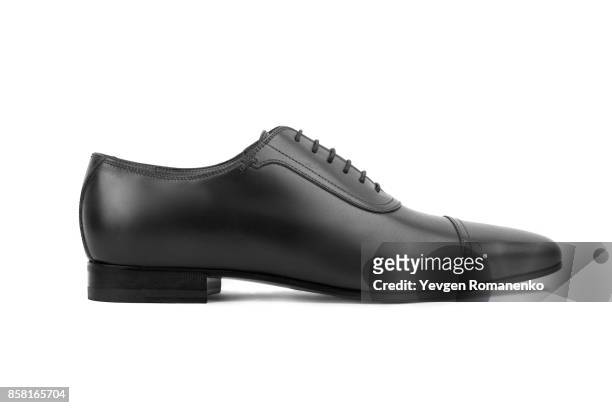 black leather male shoes, on white background - black male feet fotografías e imágenes de stock