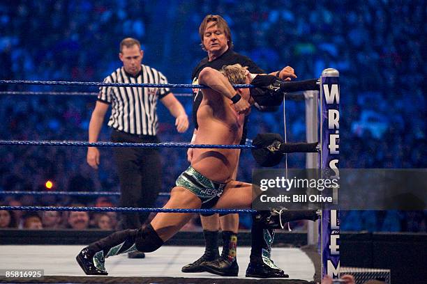 Rowdy" Roddy Piper battles WWE Superstar Chris Jericho during WrestleMania 25 at Reliant Stadium on April 5, 2009 in Houston, Texas.