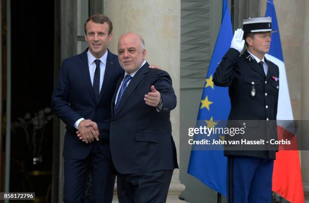 French President Emmanuel Macron receives Prime Minister of Iraq Haider al-Abadi at the Elysee Palace on October 05, 2017 in Paris.