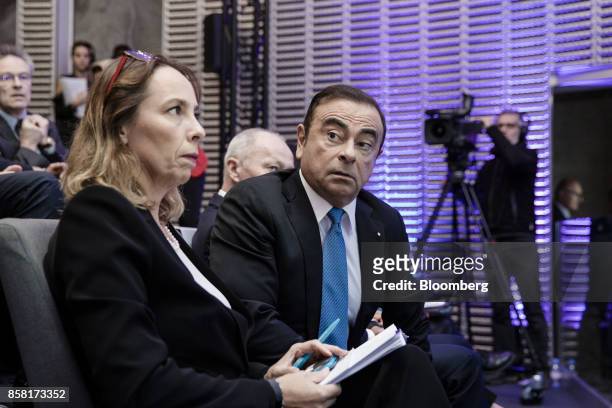 Clotilde Delbos, chief financial officer of Renault SA, left, and Carlos Ghosn, chairman of Renault SA, attend a news conference to announce the...