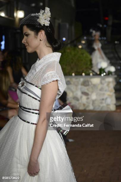 Model walks the Po de Arroz runway show at New York Fashion Week Bridal October 2017 at Hendrick's Tavern on October 5, 2017 in Roslyn, New York.
