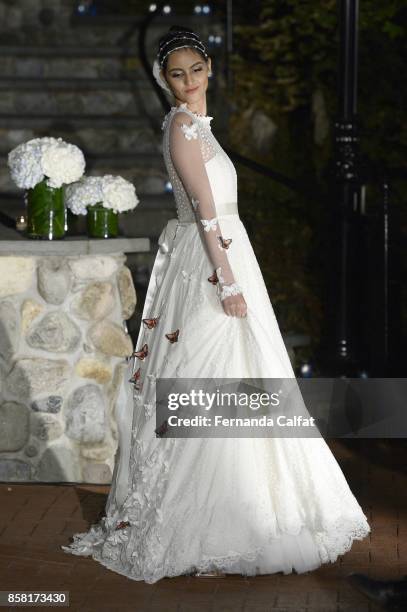 Model walks the Po de Arroz runway show at New York Fashion Week Bridal October 2017 at Hendrick's Tavern on October 5, 2017 in Roslyn, New York.