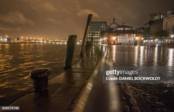 The flooded Fischmarkt place with its fish auction hall in Hamburg, northern Germany, is pictured on October 6 after a heavy storm. - Storm Xavier...