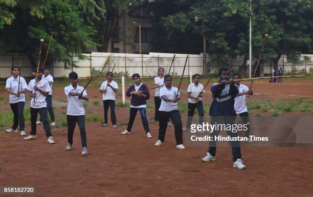 Training session of Silambam, a weapon based Indian Martial arts, on October 4, 2017 in Pune, India. The word Silambam means either a mountain or...