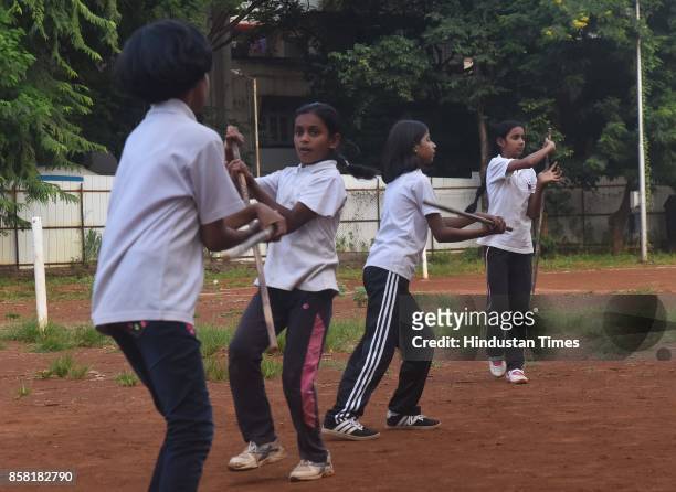 Girls display Single Stick, a type of Silambam, a weapon based Indian Martial arts, on October 4, 2017 in Pune, India. The word Silambam means either...