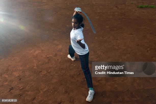 Apurva Ambede displays Steel Whip, a type of Silambam, a weapon based Indian Martial arts, on October 4, 2017 in Pune, India. The word Silambam means...