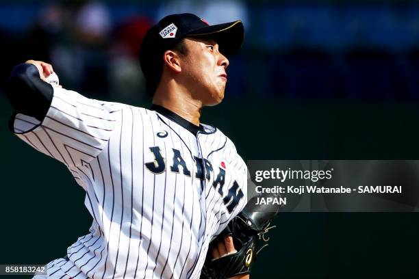 Starting pitcher Masaki Tanigawa of Japan throws a pitch in the top half of the eighth inning during the 28th Asian Baseball Championship Super Round...