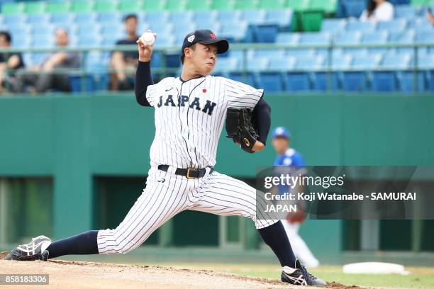 Starting pitcher Masaki Tanigawa of Japan throws in the top half of the first inning during the 28th Asian Baseball Championship Super Round match...