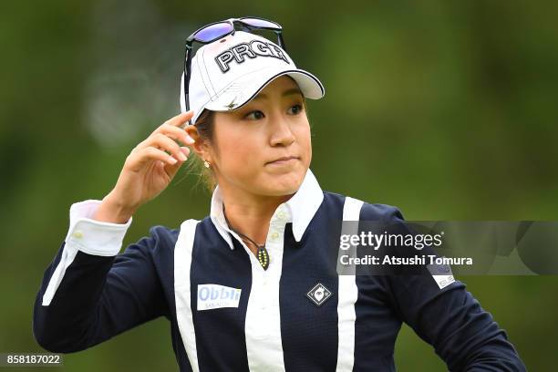 Asako Fujimoto of Japan reacts during the first round of Stanley Ladies Golf Tournament at the Tomei Country Club on October 6, 2017 in Susono,...
