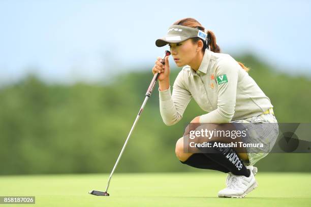 Chie Arimura of Japan lines up her putt on the 1st hole during the first round of Stanley Ladies Golf Tournament at the Tomei Country Club on October...