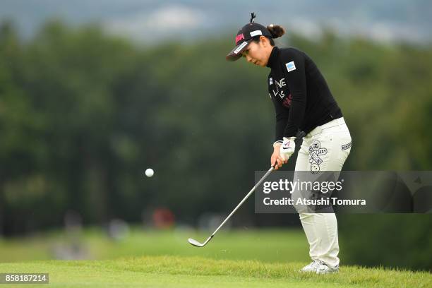 Ritsuko Ryu of Japan chips onto the 11th green during the first round of Stanley Ladies Golf Tournament at the Tomei Country Club on October 6, 2017...