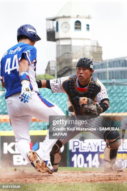 Catcher Yuki Yamauchi of Japan in action in the top half of the fifth inning during the 28th Asian Baseball Championship Super Round match between...