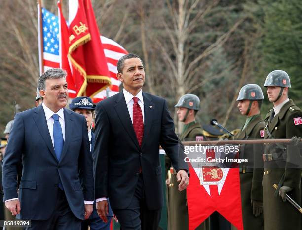 Turkish President Abdullah Gul and U.S. President Barack Obama attend a welcoming ceremony in the courtyard of the Cankaya Presidential Palace on...