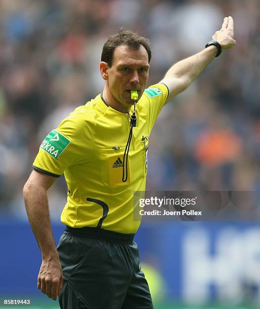 Referee Florian Meyer gestures during the Bundesliga match between Hamburger SV and 1899 Hoffenheim at the HSH Nordbank Arena on April 4, 2009 in...