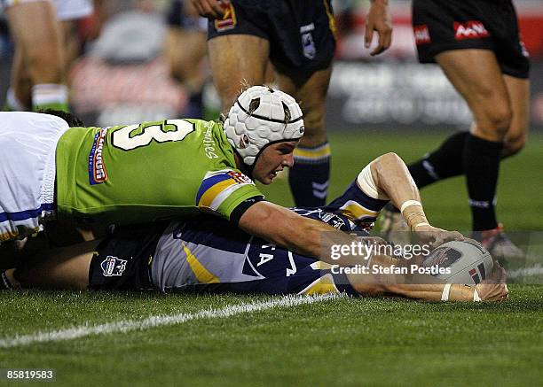 Travis Burns of the Cowboys scores a try during the round four NRL match between the Canberra Raiders and the North Queensland Cowboys at Canberra...