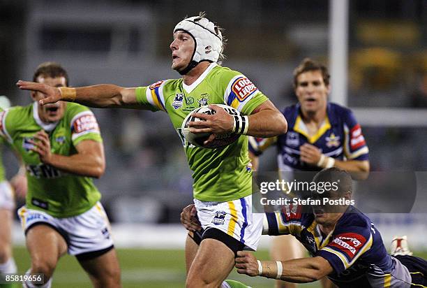 Jarrod Croker of the Raiders is tackled during the round four NRL match between the Canberra Raiders and the North Queensland Cowboys at Canberra...