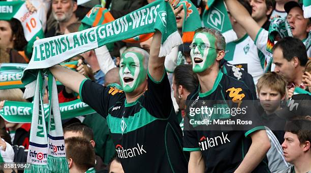 Supporter of Bremen cheer during the Bundesliga match between Werder Bremen and Hannover 96 at the Weser stadium on April 5, 2009 in Bremen, Germany.