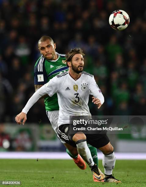 Josh Magennis of Northern Ireland and Marvin Plattenhardt of Germany during the FIFA 2018 World Cup Qualifier between Northern Ireland and Germany at...