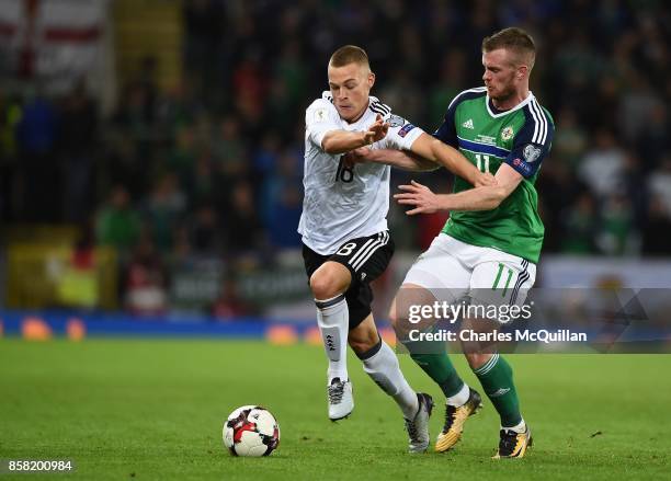 Chris Brunt of Northern Ireland and Joshua Kimmich of Germany during the FIFA 2018 World Cup Qualifier between Northern Ireland and Germany at...