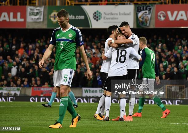 Joshua Kimmich of Germany is congratulated by team mates after scoring his side's third goal during the FIFA 2018 World Cup Qualifier between...