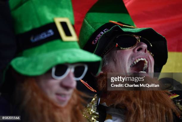 Two Germany fans dressed in leprechaun outfits sing during the FIFA 2018 World Cup Qualifier between Northern Ireland and Germany at Windsor Park on...