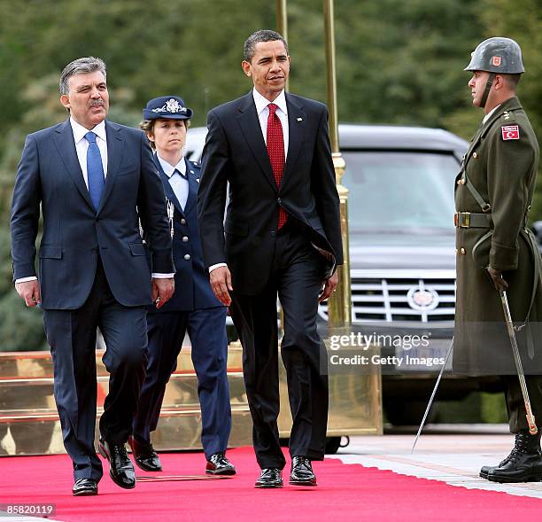 Turkish President Abdullah Gul and U.S. President Barack Obama attend a welcoming ceremony in the courtyard of the Cankaya Presidential Palace on...