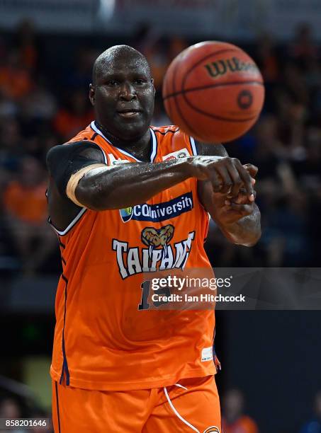 Nathan Jawai of the Taipans passes the ball during the round one NBL match between the Cairns Taipans and the Illawarra Hawks at Cairns Convention...