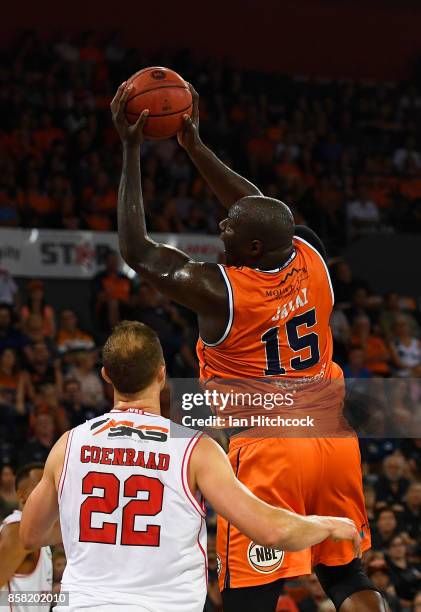 Nathan Jawai of the Taipans collects a rebound during the round one NBL match between the Cairns Taipans and the Illawarra Hawks at Cairns Convention...