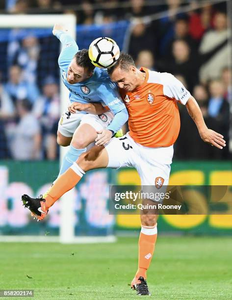 Connor Chapman of the City and Jade North of the Roar compete to head the ball during the round one A-League match between Melbourne City FC and the...