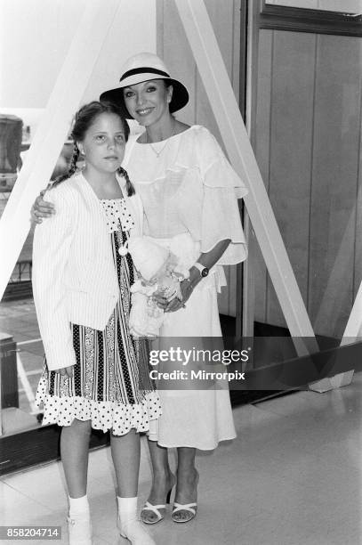 Joan Collins at LAP with her daughter Katy after a holiday in the South of France, 19th July 1983.